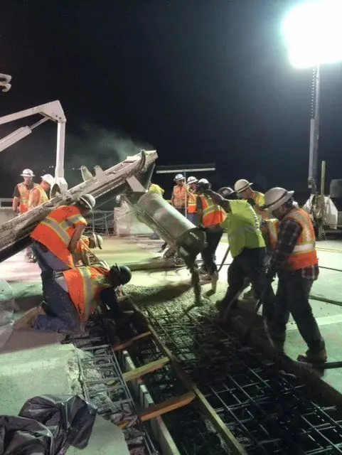 Night pour, crew in hi-vis.